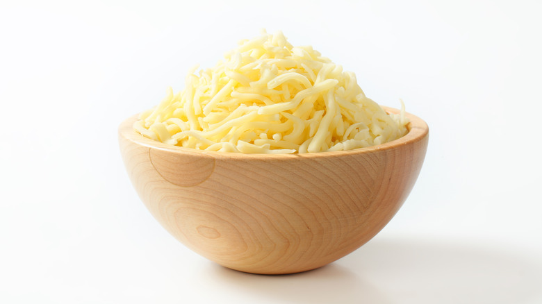 grated cheddar cheese in bowl