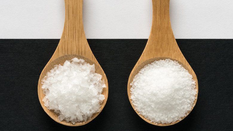 sea and kosher salt in wooden spoons