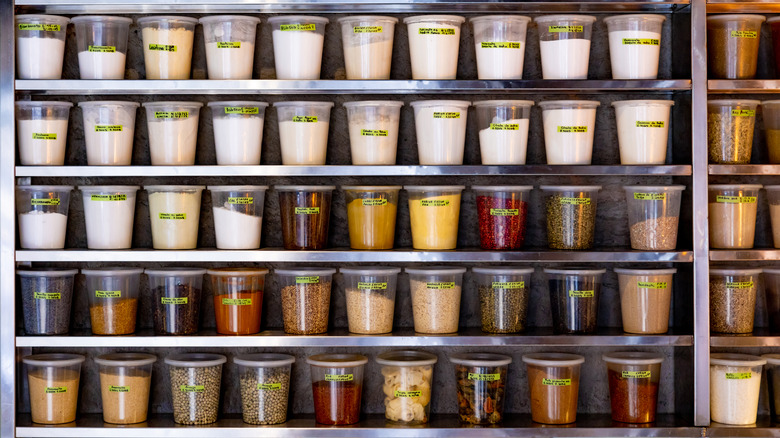 Organized quart containers in commercial kitchen pantry