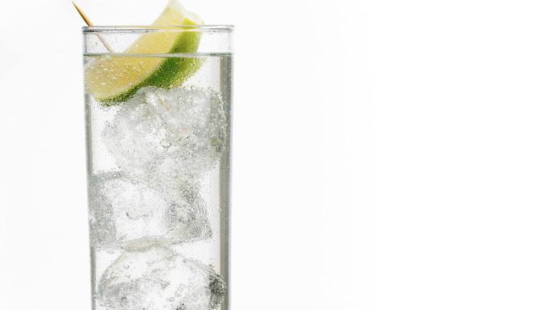 clear vodka cocktail with lime wedge