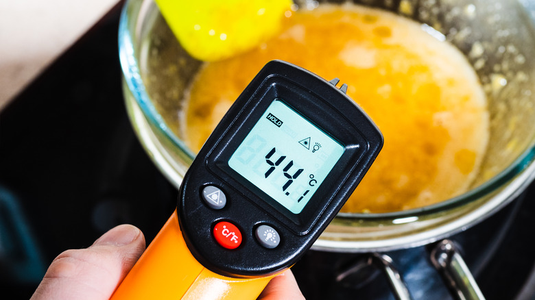 Digital thermometer scanning cooking eggs