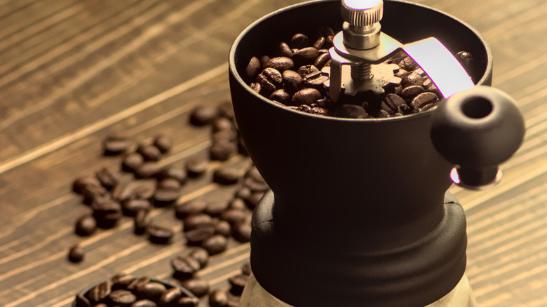 A burr coffee grinder with beans
