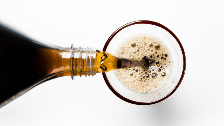 soda being poured into a glass