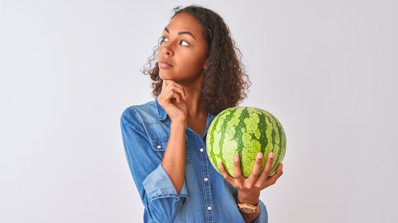 woman holding watermelon