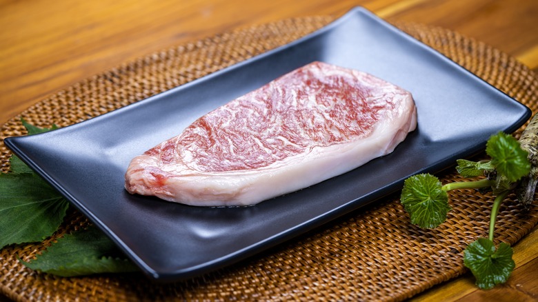 Raw A5 Japanese wagyu beef on plate