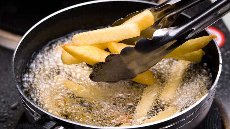 French fries cooking in a pot