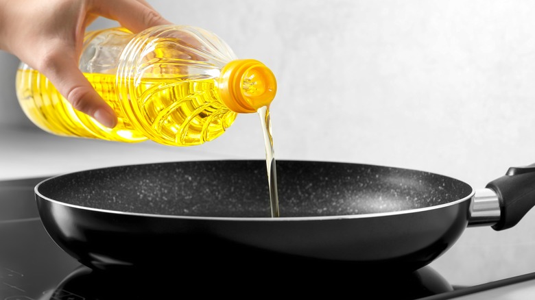 Vegetable oil being poured into a pan