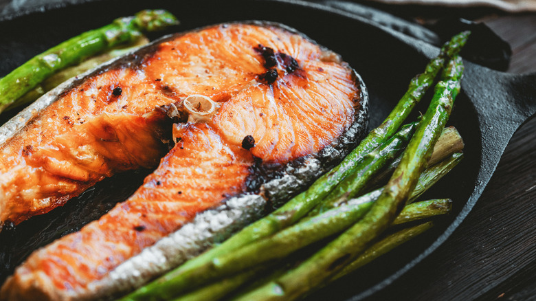 crispy salmon steak served with asparagus