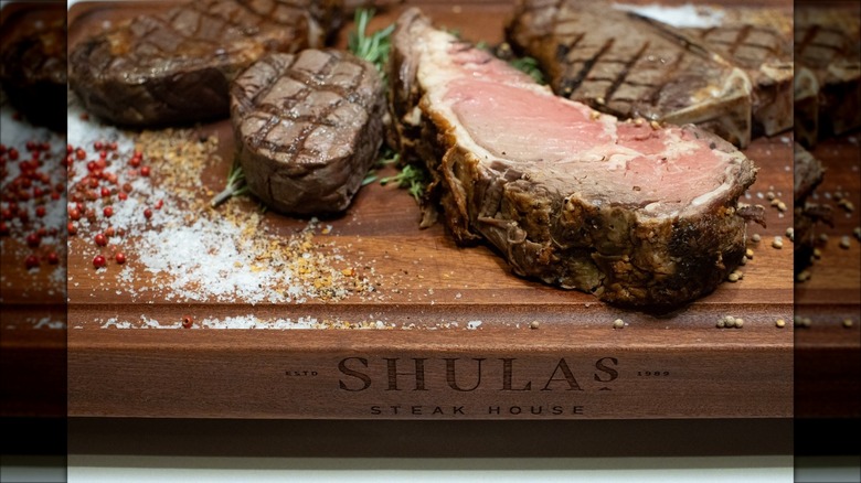 Steaks on wooden butcher's block