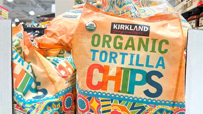 Bags of Costco's Kirkland Signature organic tortilla chips in store