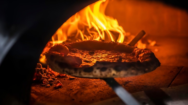 Pizza pulled from wood oven