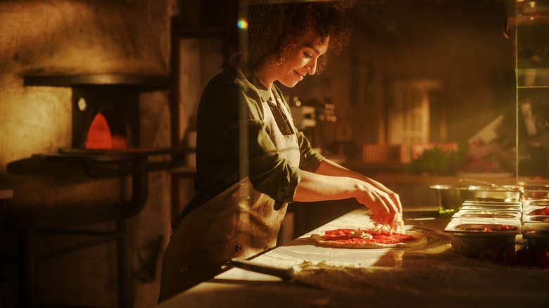 Chef preparing pizza