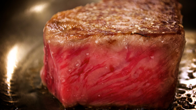 searing Japanese A5 Wagyu steak