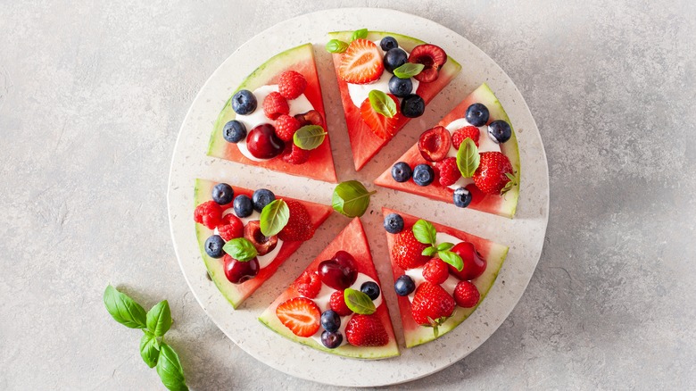 Triangles of watermelon topped with fruit