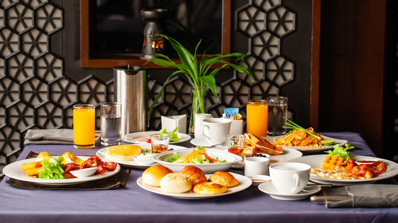 Brunch on table with purple tablecloth