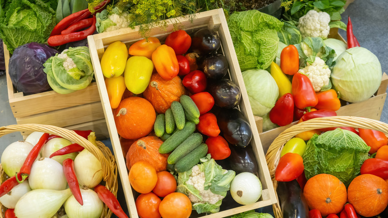 Wooden crates full of assorted vegetables and plant life