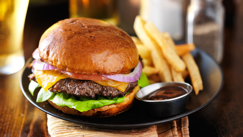 Burger and fries with sauce