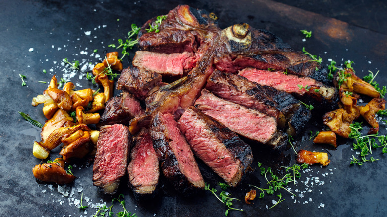 Sliced steak with fried chanterelles and seasonings