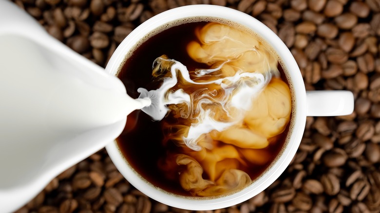 Cream going into coffee