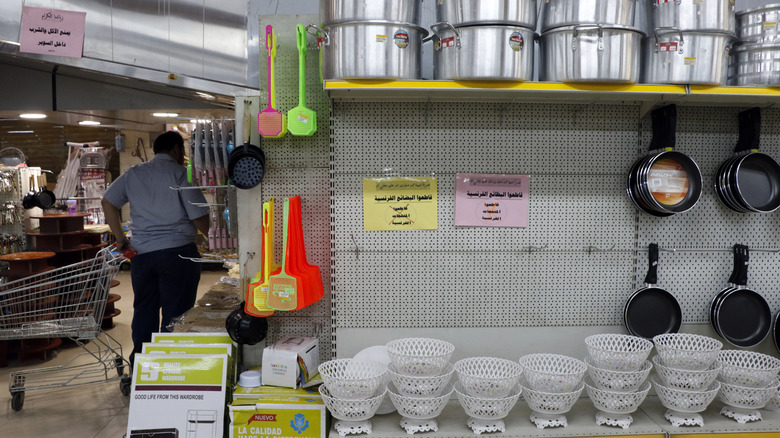 Racks of cooking tools in grocery store