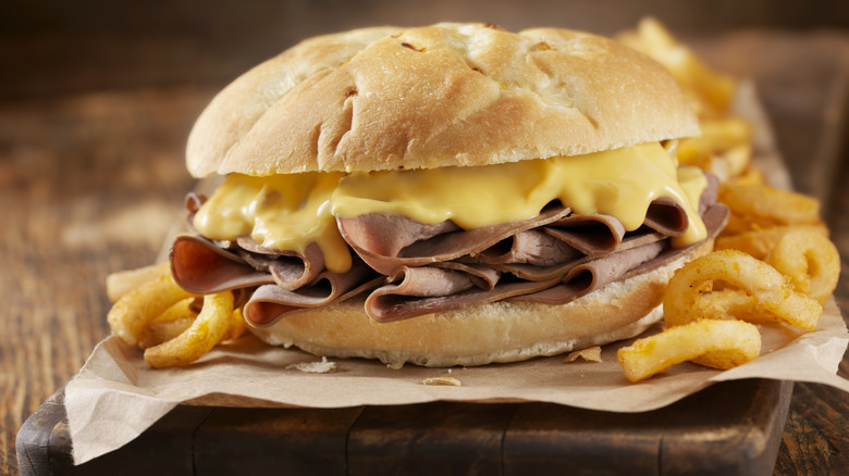 roast beef and cheddar sandwich with curly fries