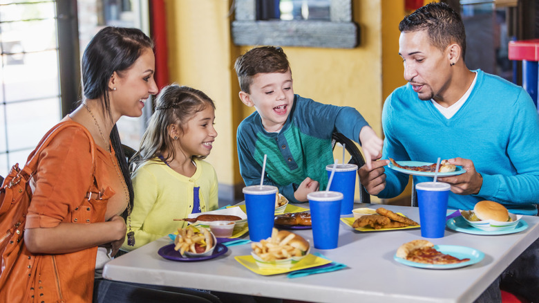 family eating at fast food restaurant