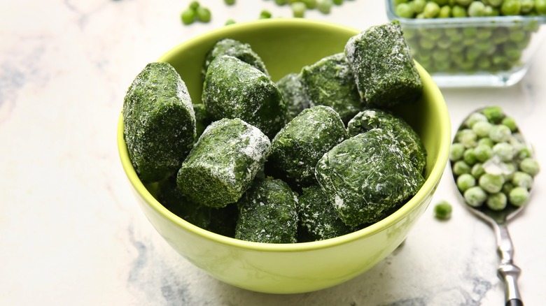 Cubes of frozen spinach in a bowl