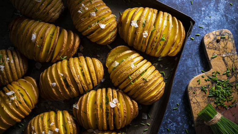 Crispy hasselback potatoes cooked with butter and oil