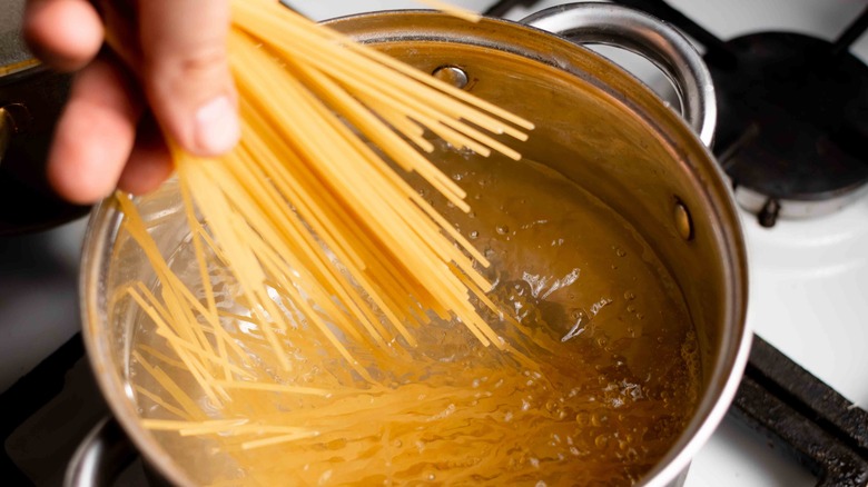 Adding pasta to boiling water