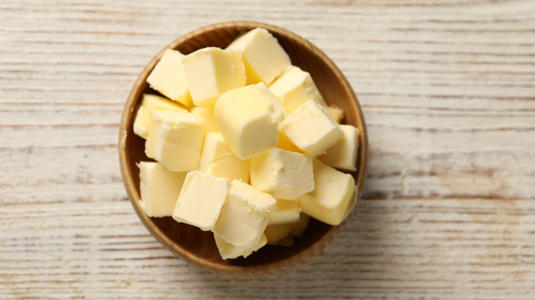 Cubes of chilled butter in a ceramic bowl.