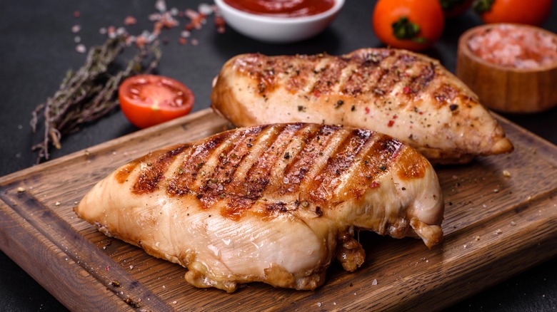two grilled chicken breasts