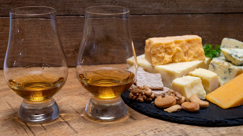 Scotch whisky glasses and cheeses