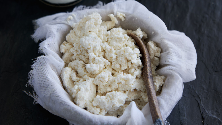 Ricotta draining in a bowl