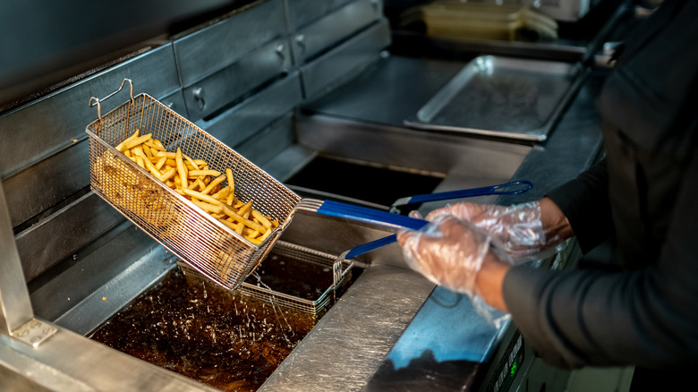 Making french fries in deep fryer