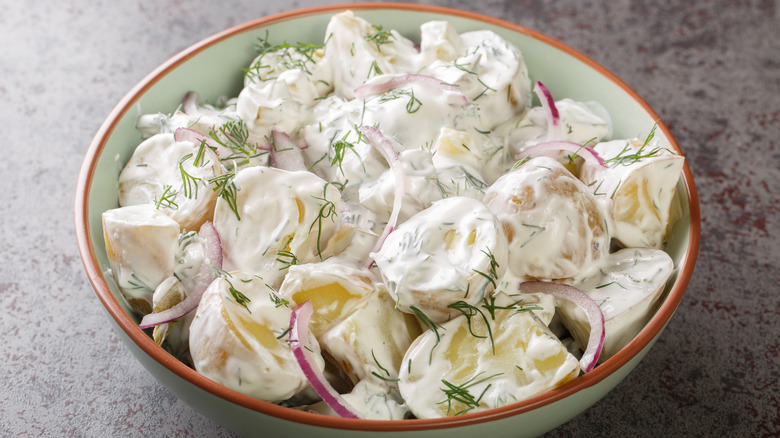 Creamy dill potato salad in bowl