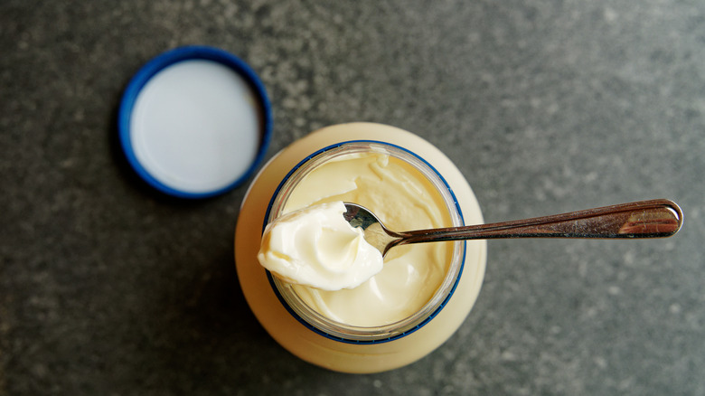 overhead view of open jar of mayonnaise 