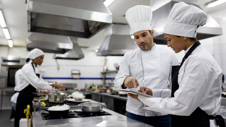 chefs working in kitchen