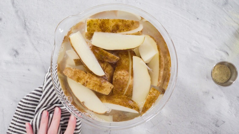 potato wedges soaking in water