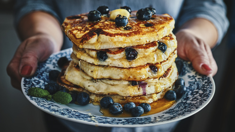 stack of fluffy pancakes with blueberries