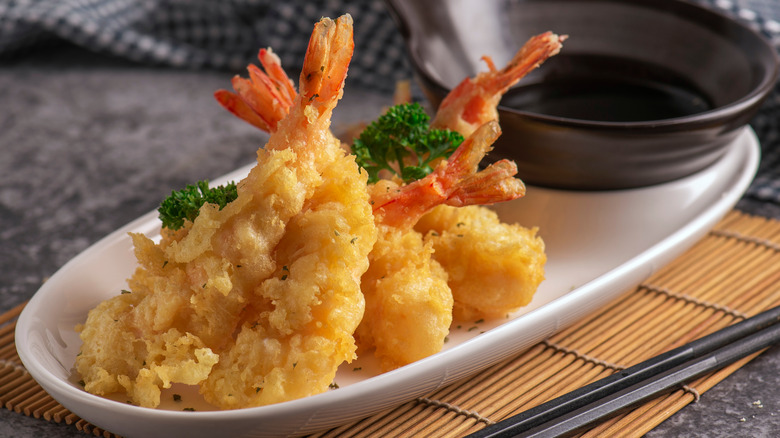 shrimp tempura on white plate with dip