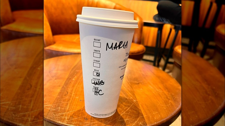 Starbucks cup with handwritten notes