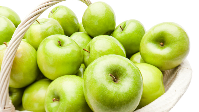 Granny Smith apples in basket 