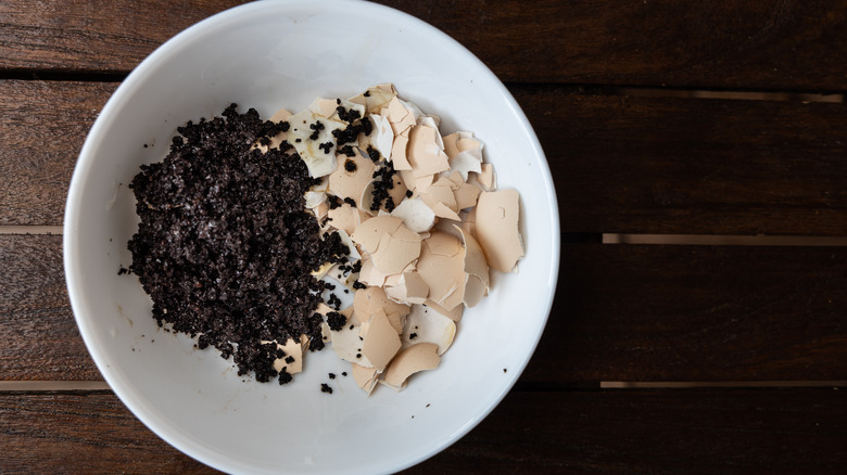 Coffee grounds and eggshells in bowl