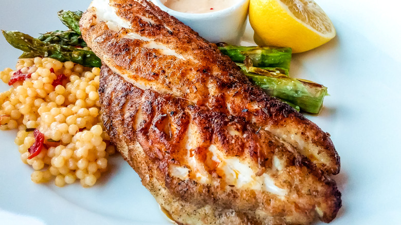 Blackend fish, cous cous and vegetables