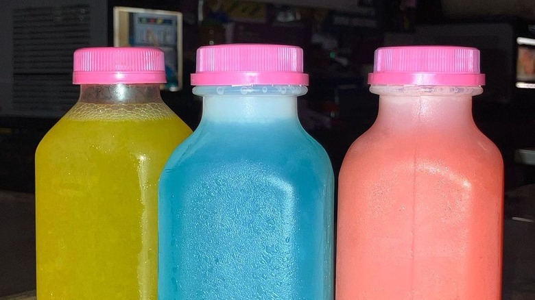 colorful plastic bottles with frozen juice inside 