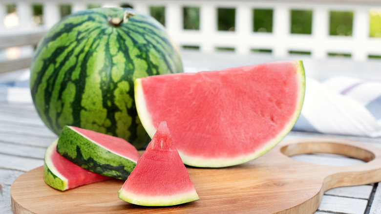 Seedless watermelon slices on cutting board
