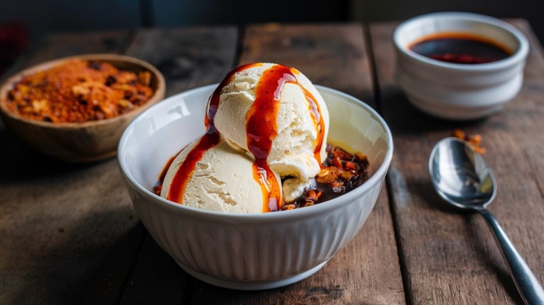 ice cream in a bowl topped with a savory sauce