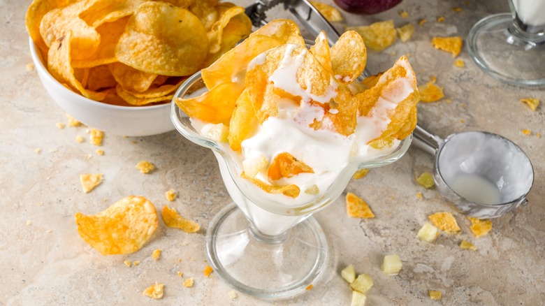 a cup of ice cream with potato chips on top