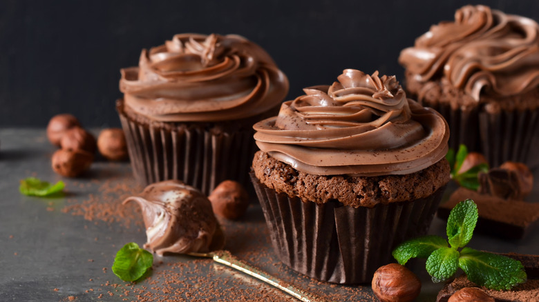 Chocolate cupcakes with chocolate frosting and mint