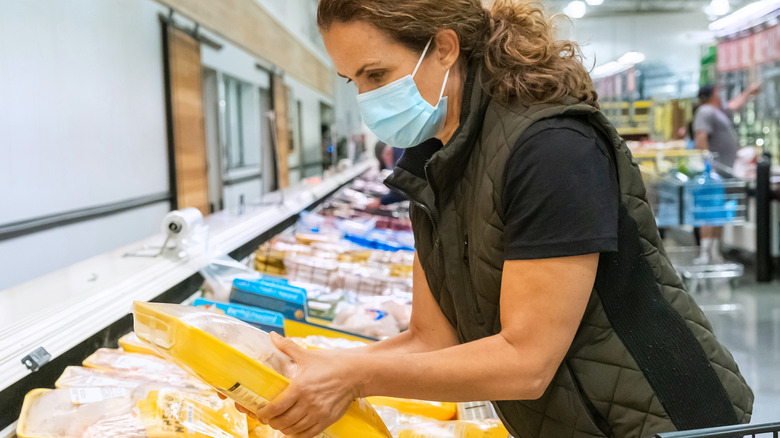 Shopping for chicken in supermarket 